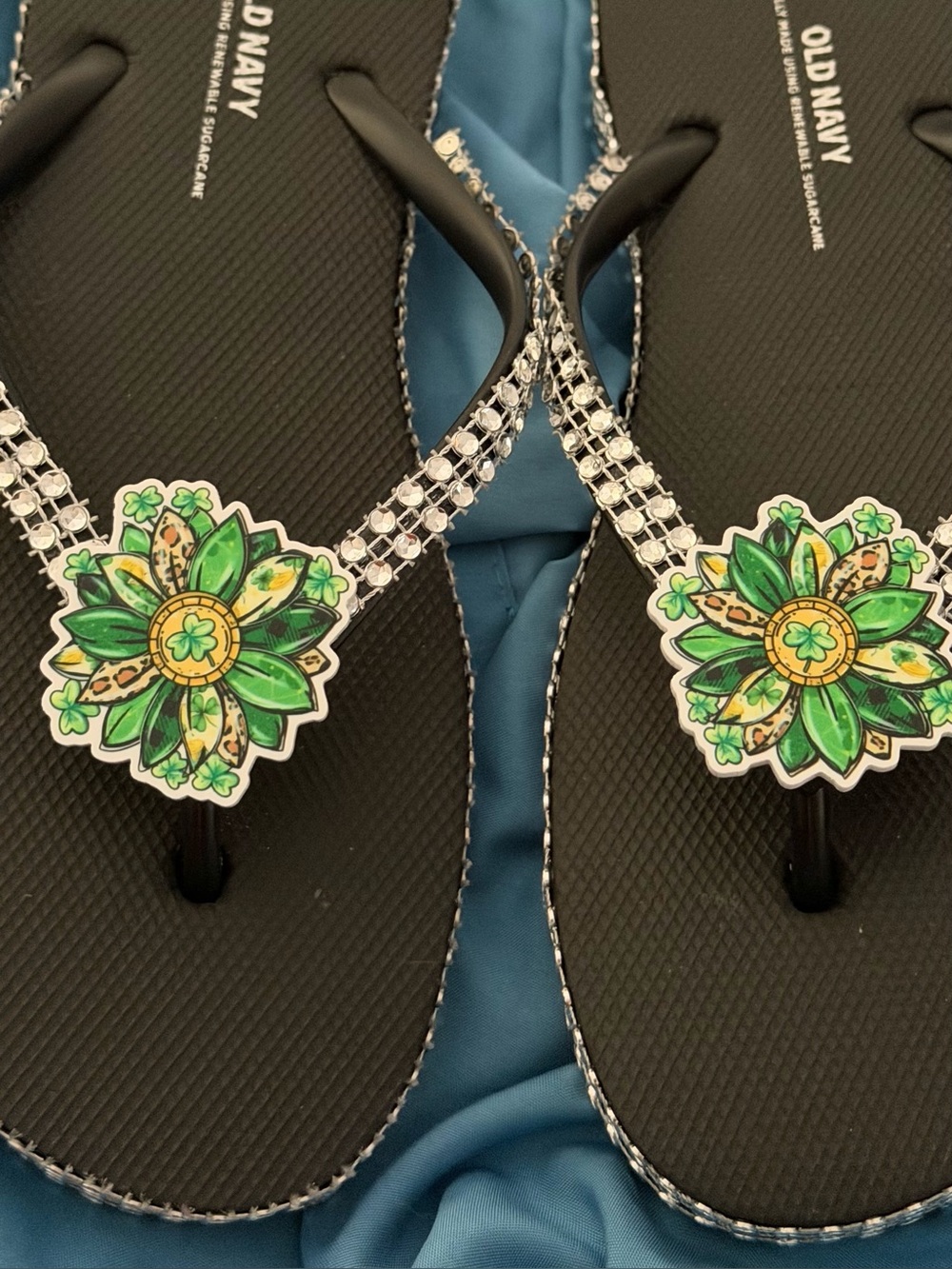 Black Flip-Flops with Green Floral Accents